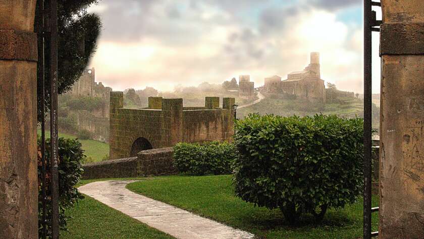Pathway Through Archway Into Garden