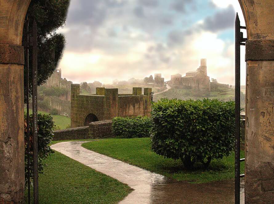 Pathway Through Archway Into Garden